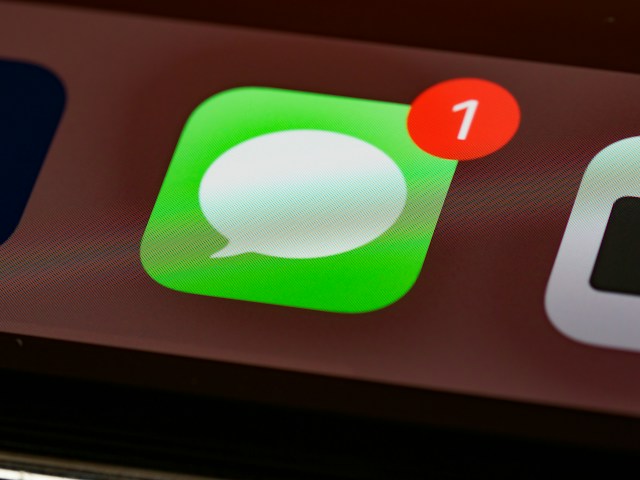 A phone lighting up with message notifications