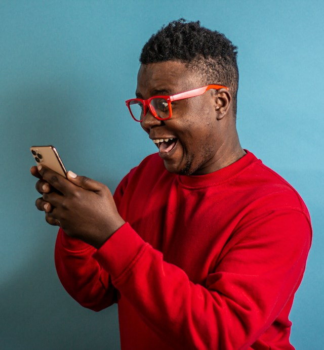 A happy customer checking their phone